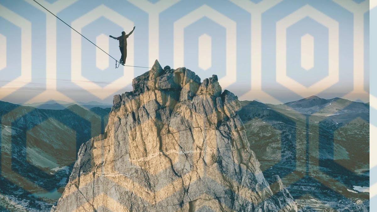 man on a tightrope going towards a mountain